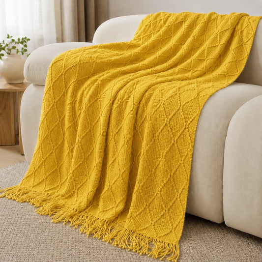 Burnt-orange knit throw draped over a couch